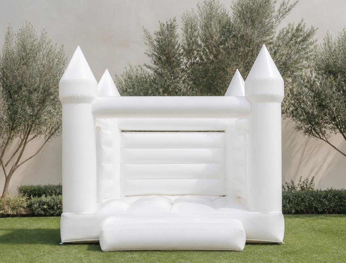 Small white inflatable bounce house on a lawn